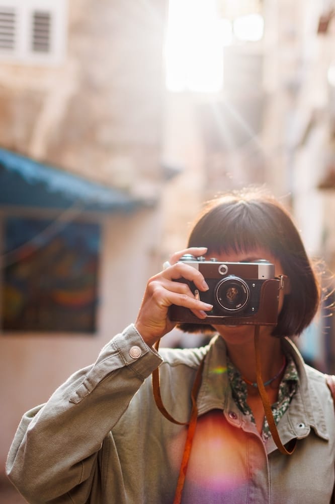 Woman,Photographer,With,A,Camera,Takes,Pictures,Outdoors.,A,Young Public Relations Company for Technology