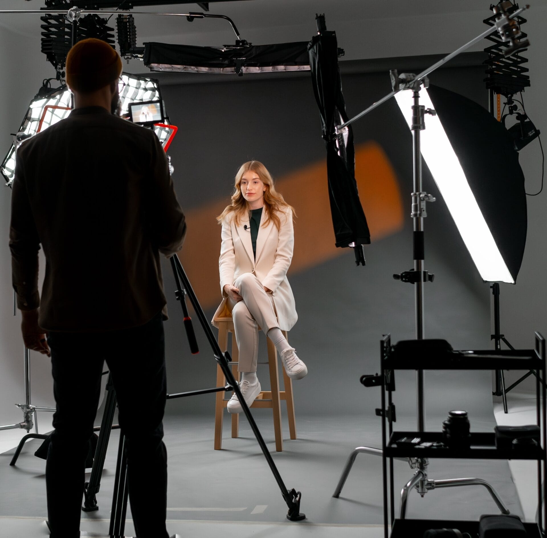 Film,Crew,On,Set,For,The,Filming,Of,A,Tv Broadcast crew filming a television interview on set—illustrating professional media production, interview coordination, and brand storytelling through earned media.</p>
<p>