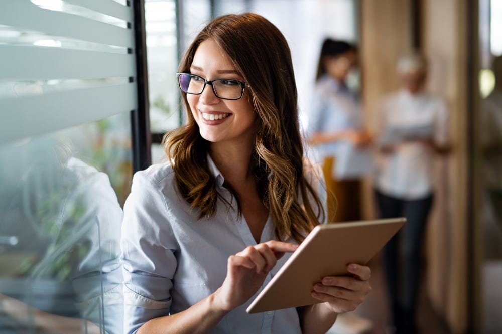 Businessperson using tablet for social media management for PR. 