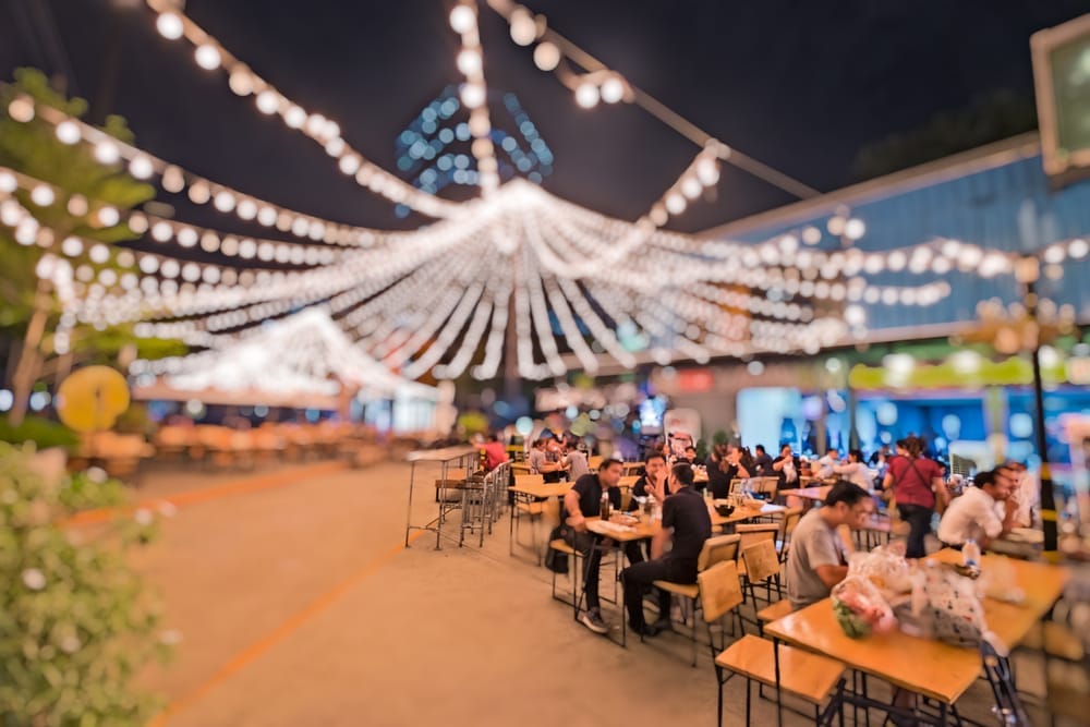 Outdoor seating at successful restaurant chain popular with millenials